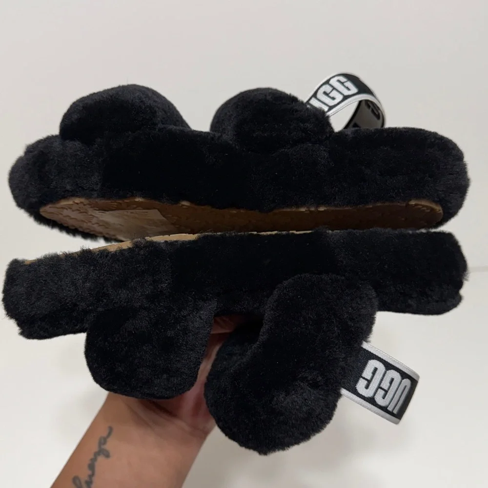 UGG “Oh Yeah” Slide Sandals in Black Sheepskin with an Elastic UGG Logo Strap